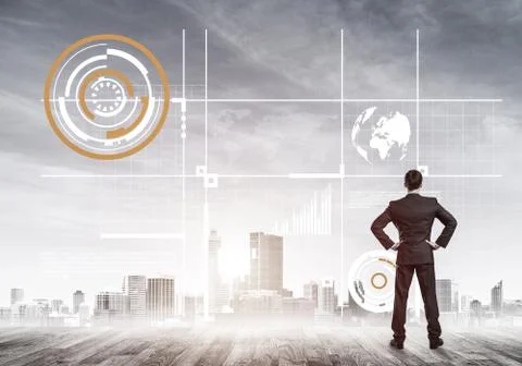 Pensive businessman looking at user interface against modern cit Stockfoto's