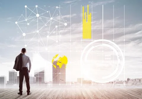 Pensive businessman looking at user interface against modern city background 스톡 사진