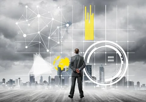 Pensive businessman looking at user interface against modern city background 스톡 사진