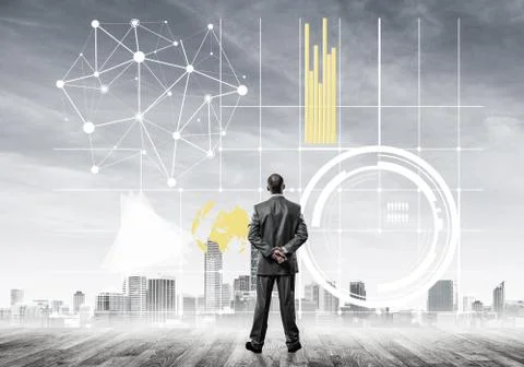Pensive businessman looking at user interface against modern cit 스톡 사진