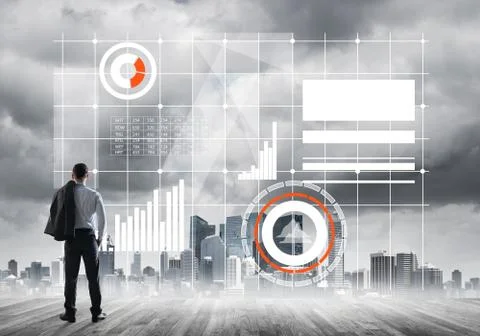 Pensive businessman looking at user interface against modern city background 写真素材