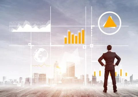 Pensive businessman looking at user interface against modern city background 스톡 사진