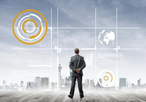 Pensive businessman looking at user interface against modern city background Foto stock