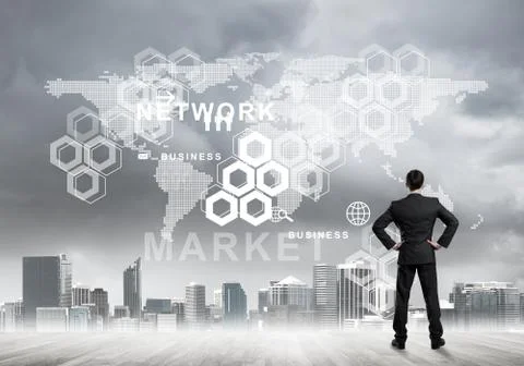 Pensive businessman looking at user interface against modern city background Stockfoto's
