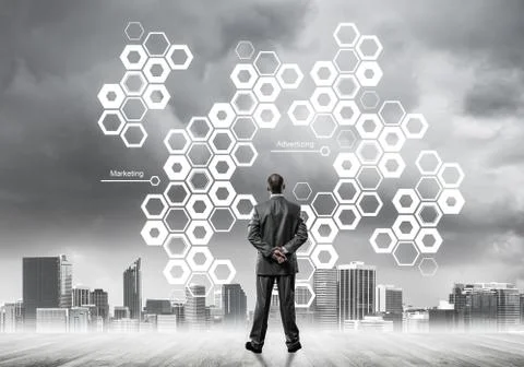 Pensive businessman looking at user interface against modern cit Foto stock