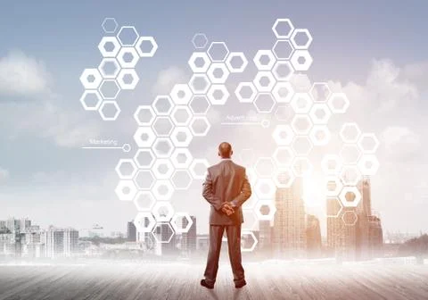Pensive businessman looking at user interface against modern city background Foto stock