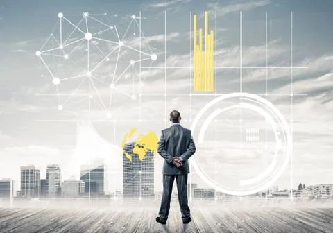 Pensive businessman looking at user interface against modern cit 스톡 사진
