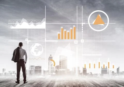 Pensive businessman looking at user interface against modern city background Foto stock