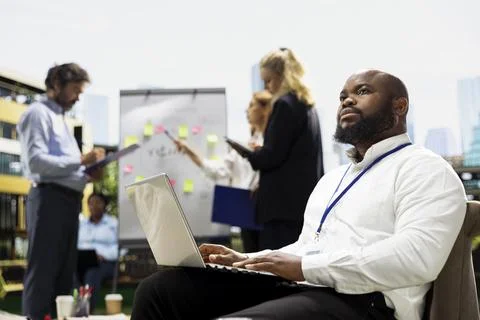 Pensive businessman thinking about plan and pausing laptop work 스톡 사진