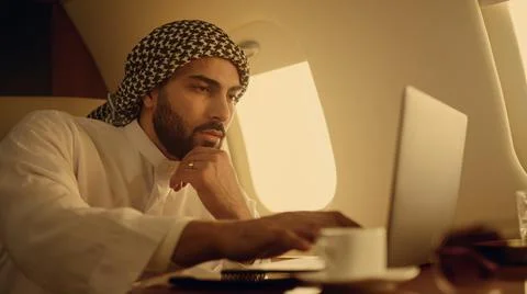 Pensive ceo solving problem on business trip closeup. Focused arab typing laptop Foto stock
