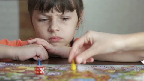 Pensive child with board game. Stock Footage 192118108