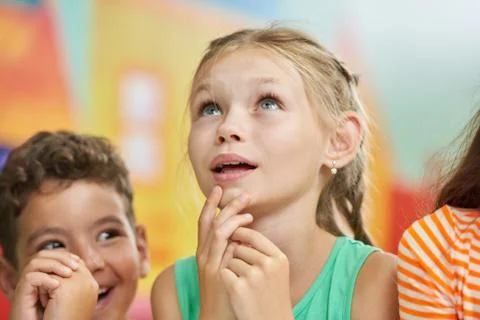 Pensive child looking up. Stock Photos