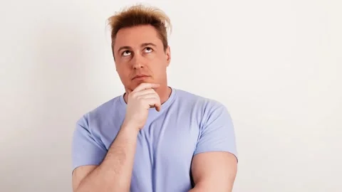 Pensive confused man thinking over choice, imagining plan in mind, idea Stock Footage 234532437