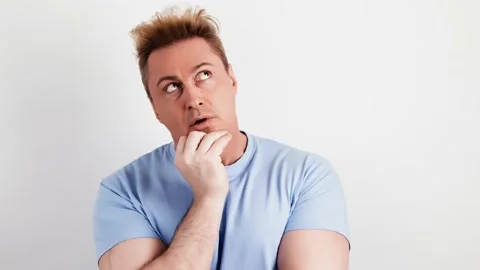 Pensive confused man thinking over choice, imagining plan, idea, guy puzzled Stock Footage 235367610