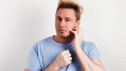 Pensive confused man thinking over choice, imagining plan, idea, guy puzzled Stock Footage 235367613