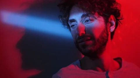 Pensive depressed young man crying in the dark, his girlfriend left him Video stock 103540917