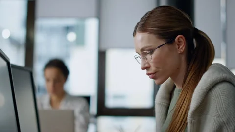 Pensive developer analyzing software closeup. Thoughtful woman looking computer Stock Footage 242985314