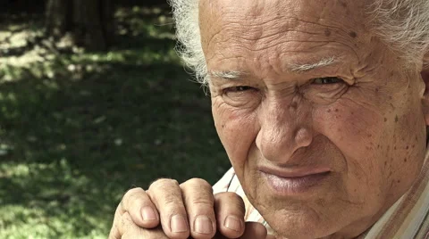 Pensive e serene old man in the garden sitting alone thoughtful Stock-Footage 64270995