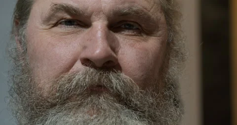 A pensive elderly man looks at the camera. Close-up. High quality. Stock Footage 165211281