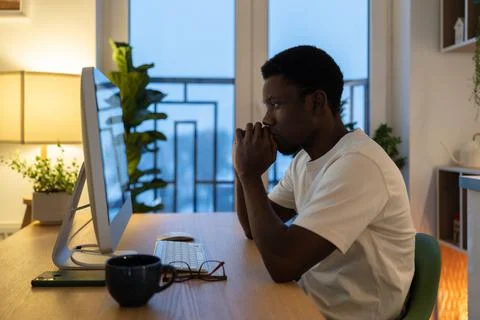 Pensive freelance programmer thoughtful work on application software or website Stock Photos