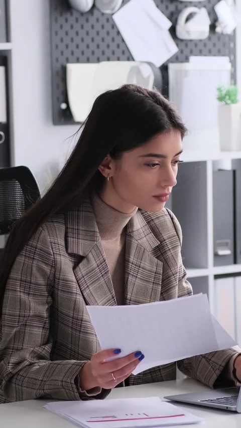 Pensive Freelancer Engaged In Paperwork And Working With Laptop In The Office Видео 287318257