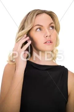 Pensive gorgeous blonde in black dress on the phone Stock Photos