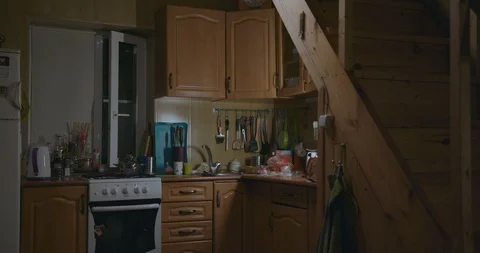 Pensive guy cooks at kitchen. Shoot on 4k Stock Footage 120836683