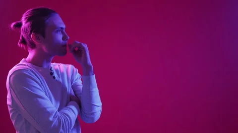 Pensive guy neon light people confused puzzled man Stock Footage 201738022