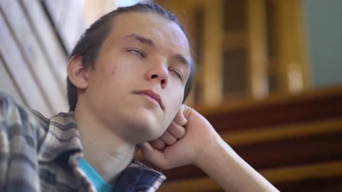 Pensive guy sitting on the stairs. Stock Footage 202081832