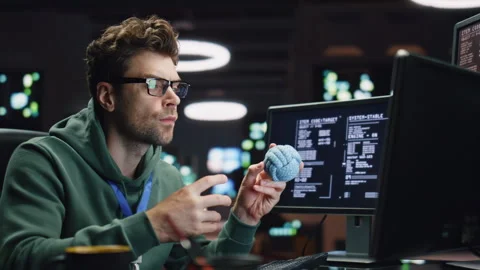 Pensive IT man working computer in late data center closeup. Coder guy creating Stock Footage 260248792