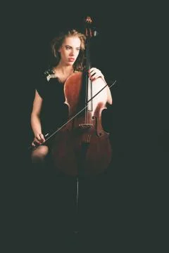 Pensive Lady Cellist Holding a Cello Instrument Stock Photos