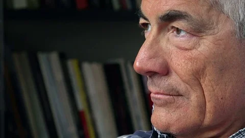 Pensive lonely man sitting deep in his thoughts at home: bored mature man  Video stock 73139097