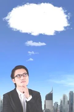 Pensive male manager with empty cloud bubble Foto stock