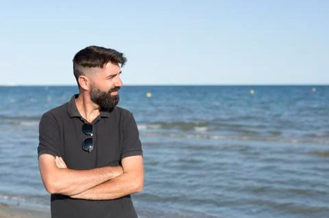 Pensive man on a beach. Stock Photos