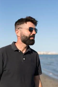 Pensive man on a beach. Stock Photos