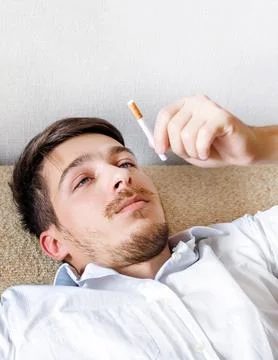 Pensive Man with a Cigarette Stock Photos