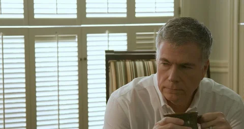 Pensive man drinking coffee and thinking 4k Stock Footage 95765863