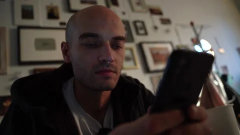 Pensive man drinking coffee in a cafe close-up Video stock 224332290
