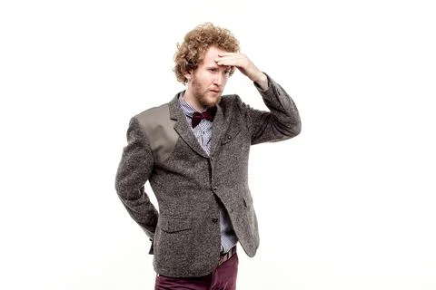 Pensive man with hand on forehead Stock Photos