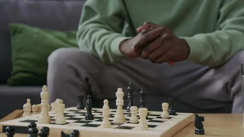Pensive Man Looking at Chess Board and Thinking about Game Strategy Stock Footage 290467543