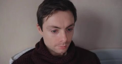 Pensive man looking at laptop screen Stock Footage 147595489