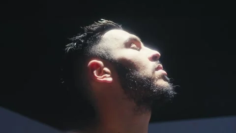 Pensive Man Looking Toward Light Stock Footage 307409230
