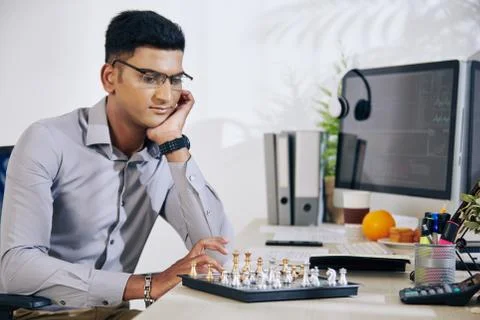 Pensive man playing chess Stock Photos
