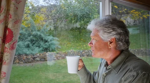 PENSIVE MAN AT RAINY WINDOW Stock Footage 45203877
