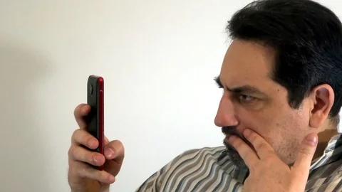 Pensive man with a smartphone Stock Footage 93099205