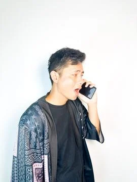 Pensive Man Talking on Mobile Phone Stock Photos