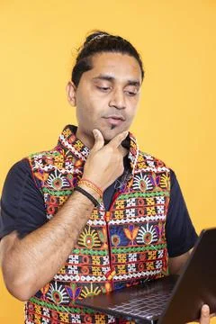 Pensive man thinking how to solve business tasks on laptop Stock Photos