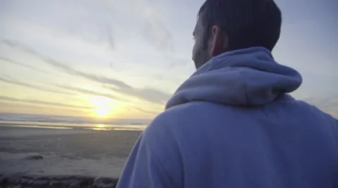 Pensive man watches the sunset Stock Footage 59867741
