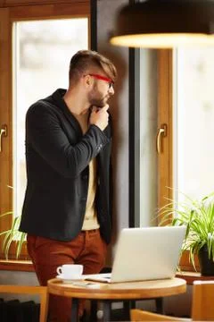 Pensive man working in cafe Stock Photos