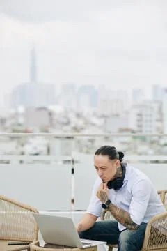 Pensive man working on rooftop 스톡 사진